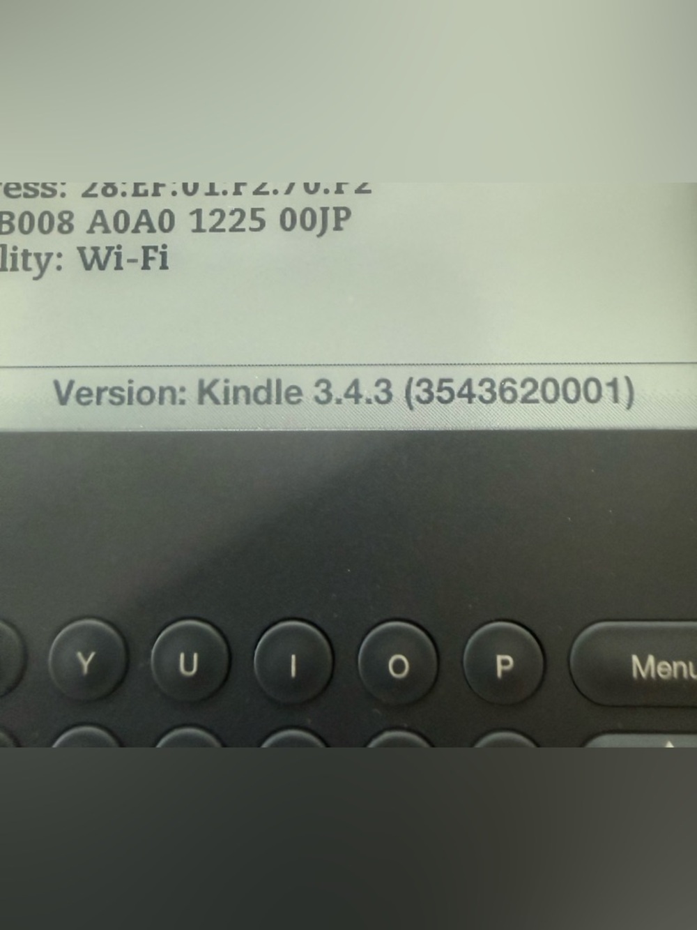 Amazon Kindle E-reader in Black with White Charger and Tan Quick Start Guide - Picture 2 of 3